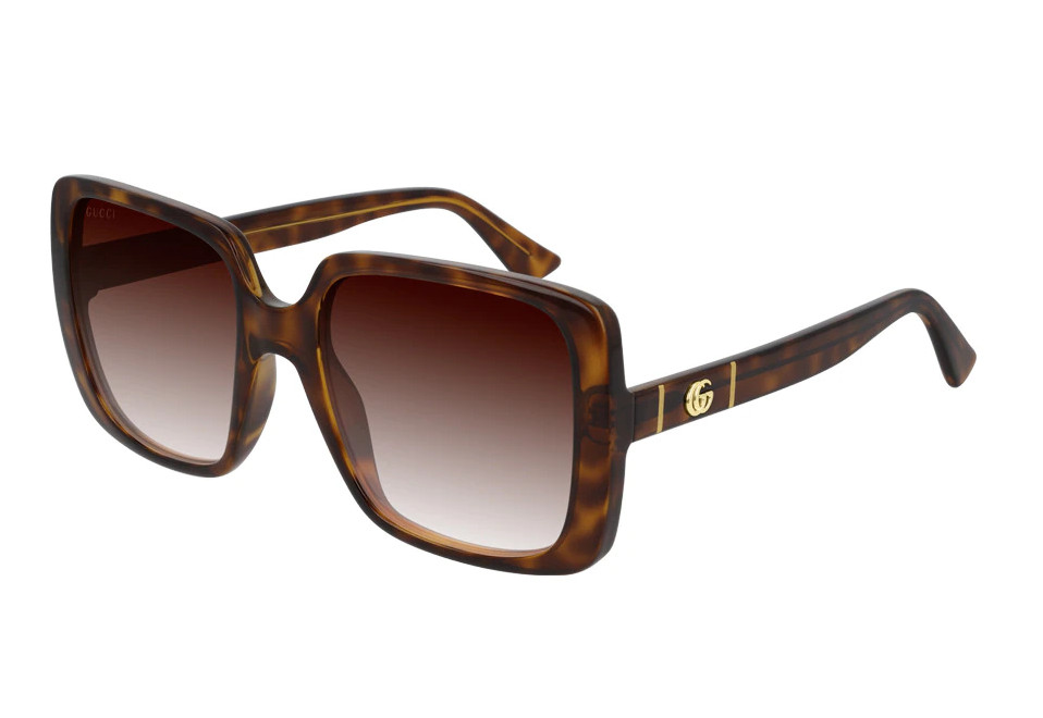 Gafas de Gucci 'oversize' en havana con detalle de la marca.